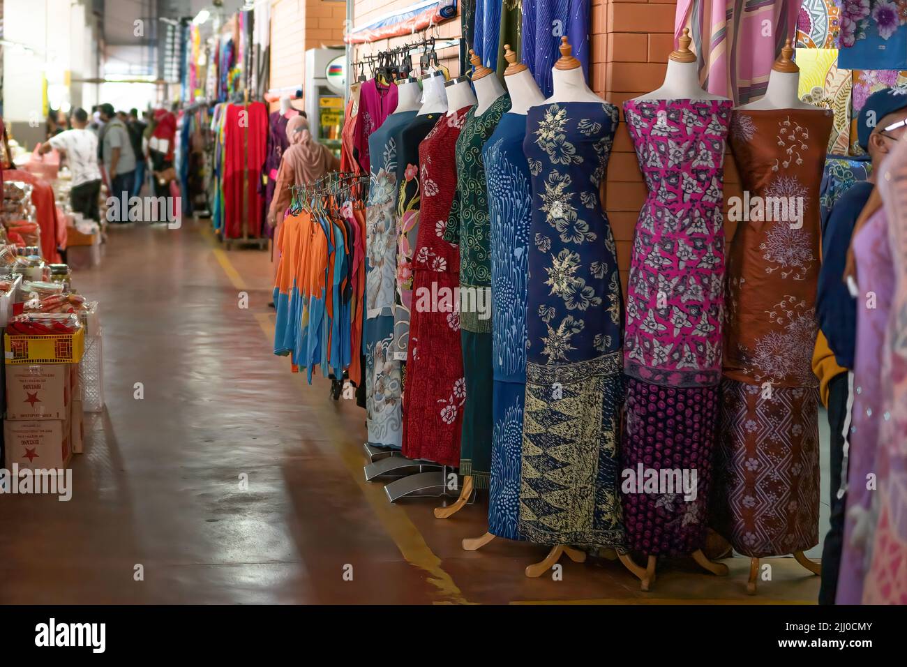 Terengganu, Malaysia: Jan 16, 2022 - Display of local textiles in front of small shops Stock Photo