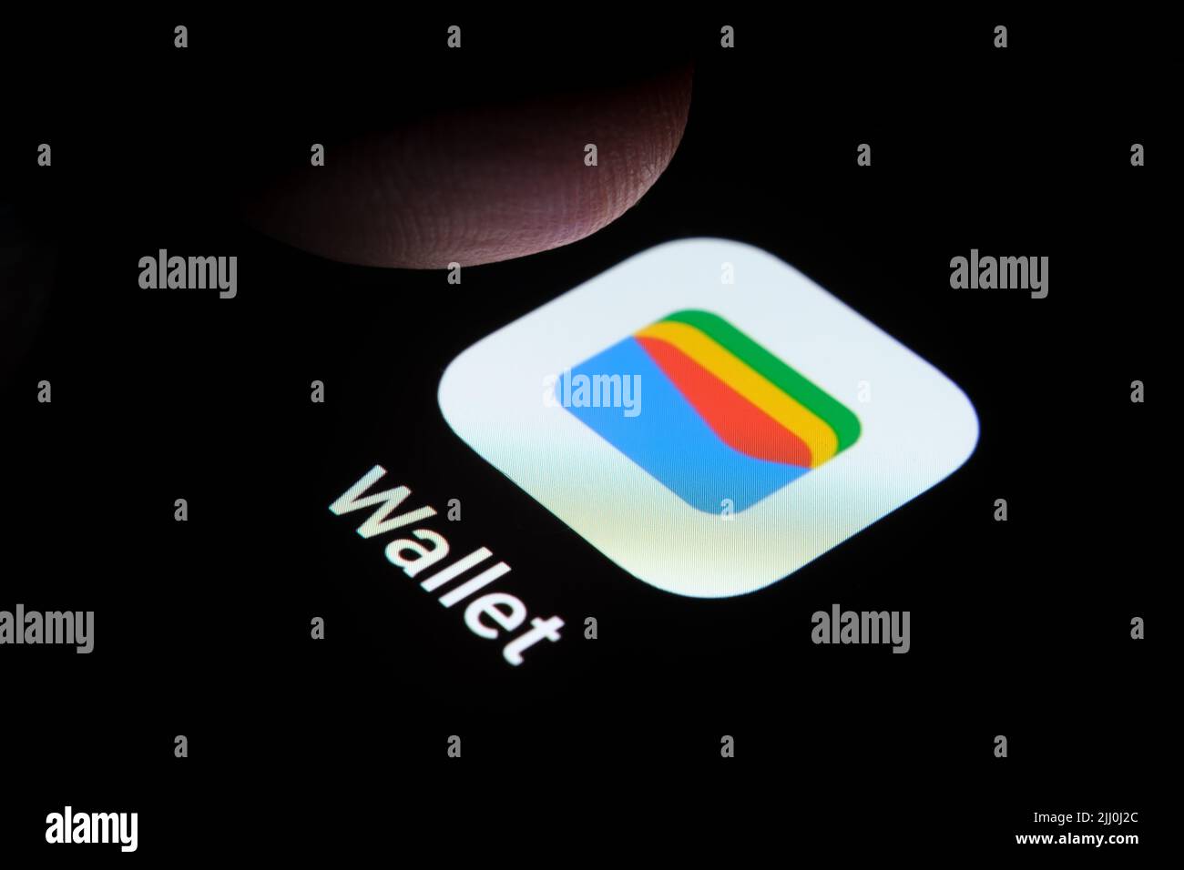 New Google Wallet app seen on the screen of smartphone and finger tip above it. Google Pay rebranded to Google Wallet. Stafford, United Kingdom, July Stock Photo