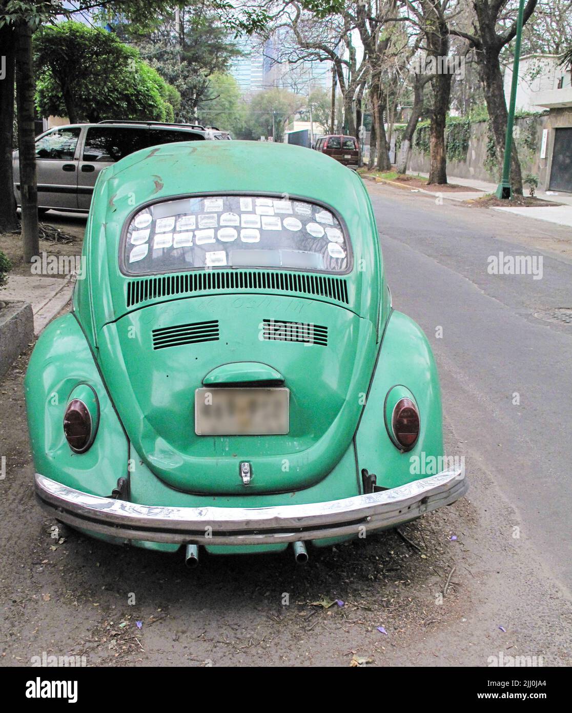 VW Beetle rear window obscured by stickers Stock Photo