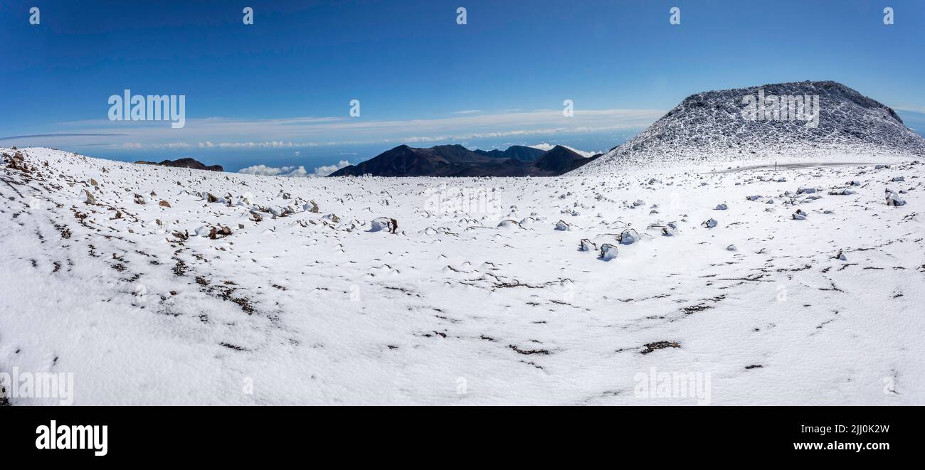 A rare snowfall near the sumit of Haleakala Crater in Haleakala National Park, Maui's dormant volcano, Hawaii. Four image files were combined for this Stock Photo
