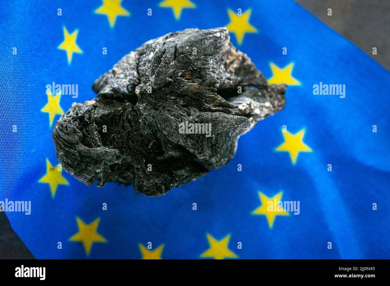Coal in Europe.Charcoal on the EU flag.Buying and selling coal in the