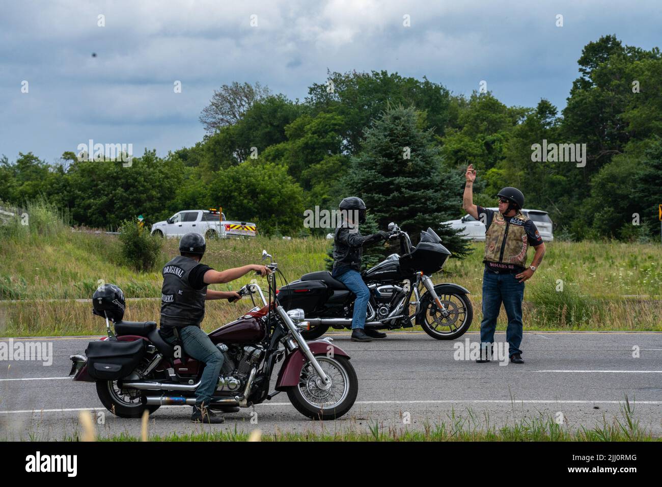 Aurora, Canada. 21st July, 2022. A member of the Hells Angels directs ...
