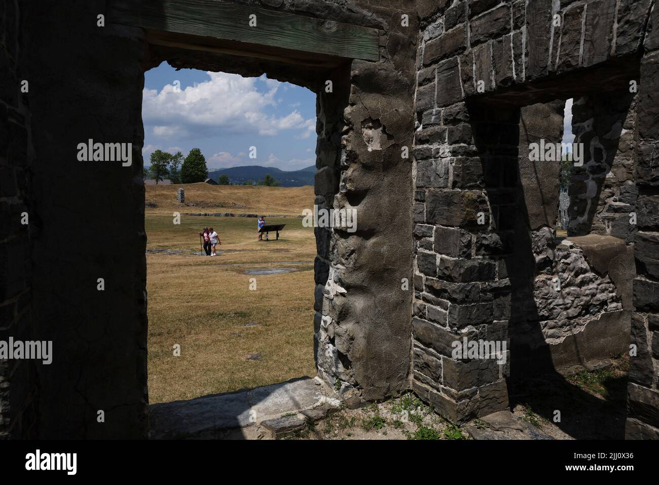 People visit the Crown Point State Historic Site, a former military stronghold used in the Revolutionary War, at the shores of Lake Champlain in Crown Point, New York, U.S., July 21, 2022. REUTERS/Shannon Stapleton Stock Photo
