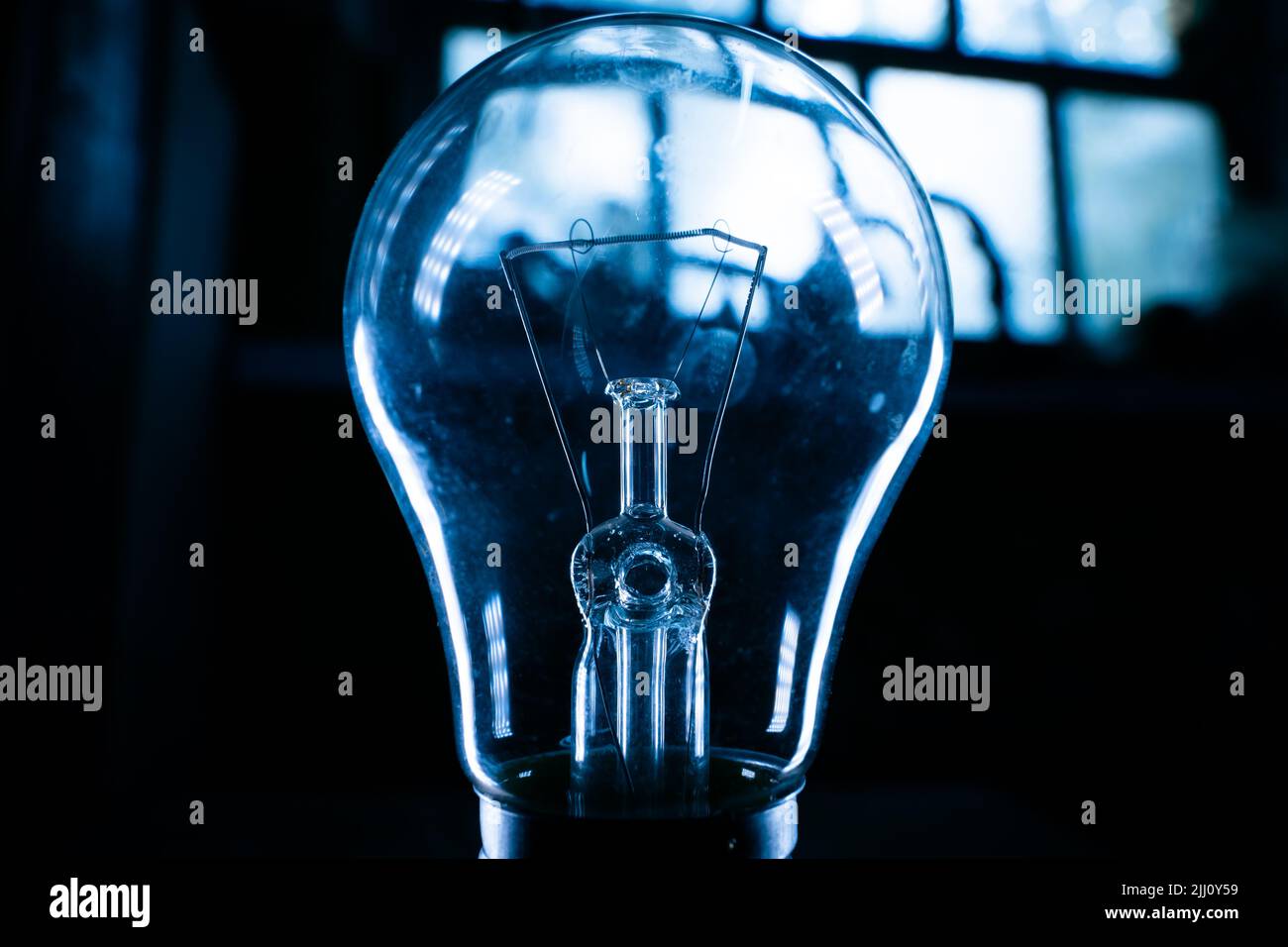 Glass light bulb closeup in a dark room Stock Photo Alamy