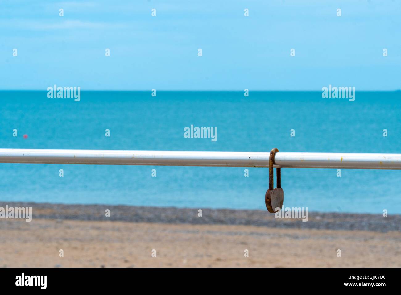 Rusty love background blue sea blurred old chain day fence, concept metal padlock from steel from romance horizon, romantic lover. Summer water wire, Stock Photo