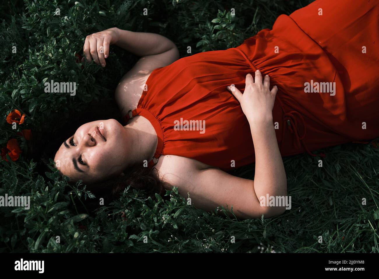 Red dress lies hi-res stock photography and images - Alamy