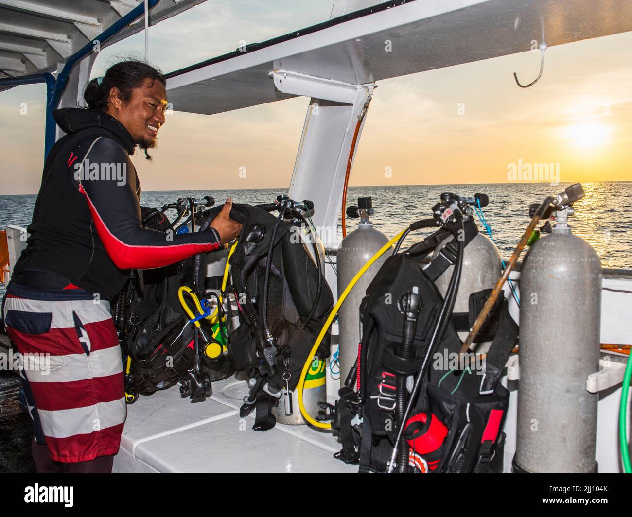 getting ready for a dive on a research vessel at Tubbataha reef Stock Photo