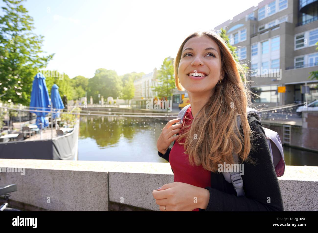 Beautiful excited school exchange girl visiting Europe within the