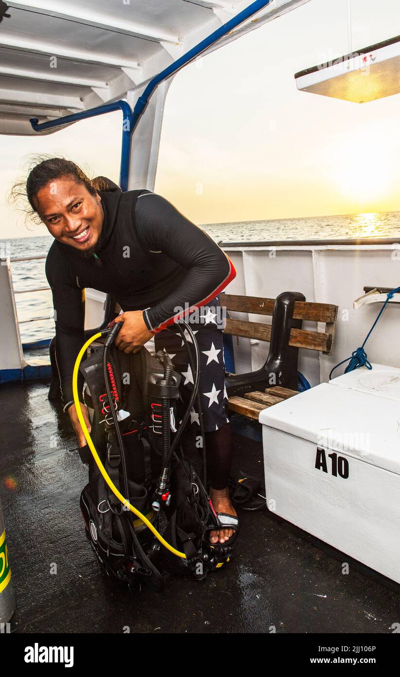 getting ready for a dive on a research vessel at Tubbataha reef Stock Photo