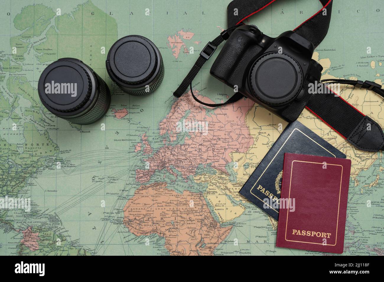 Maps of the world together with a camera and passports. Concept of vacation, travel, travelers, Holiday. Copy space. Stock Photo