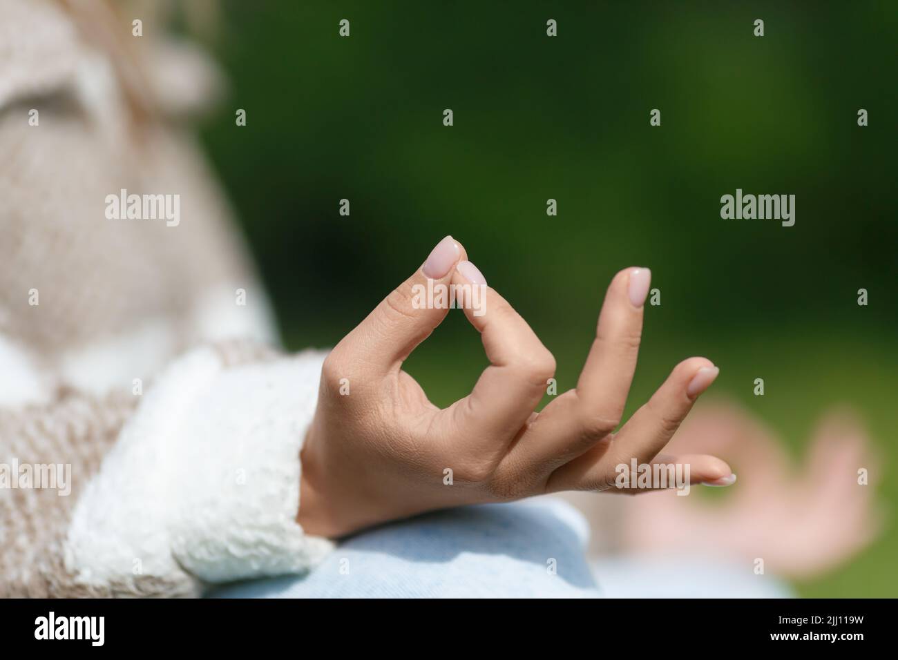 Meditation hands. Close-up photo of a female hand durin outdoor ...