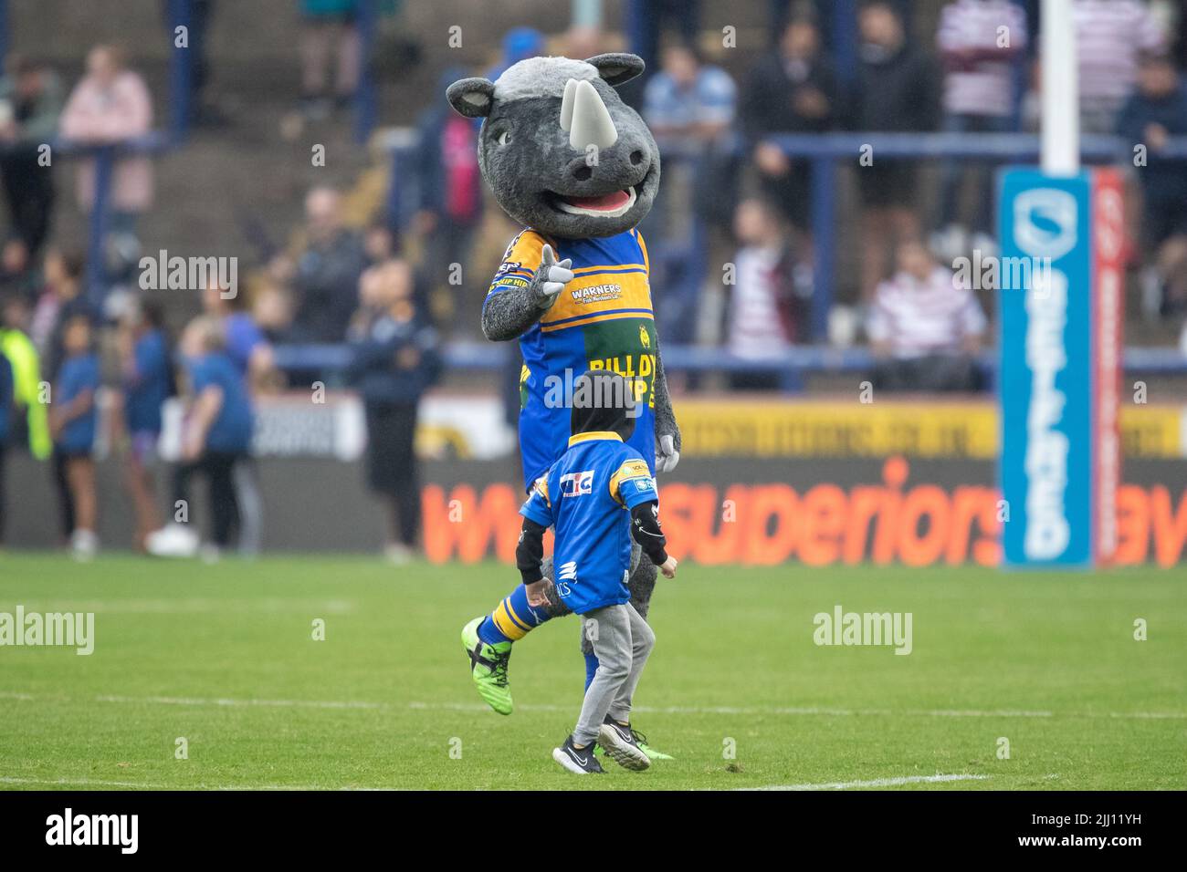 Mascot Ronnie The Rhino dances with a young Leeds Rhinos supporter ...