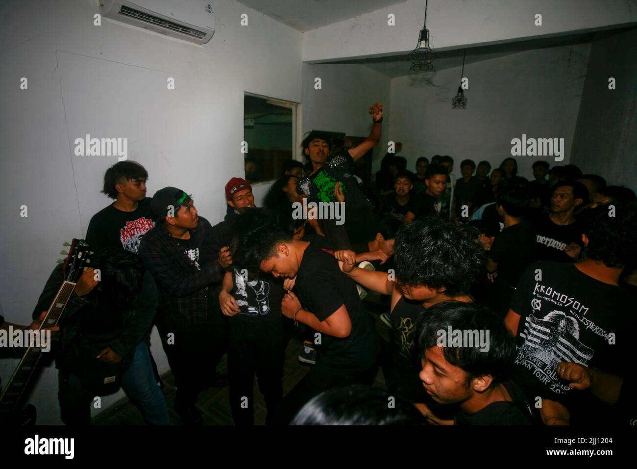Asian Young Man Dancing And Crowdsurfing In The Moshpit Stock Photo Alamy