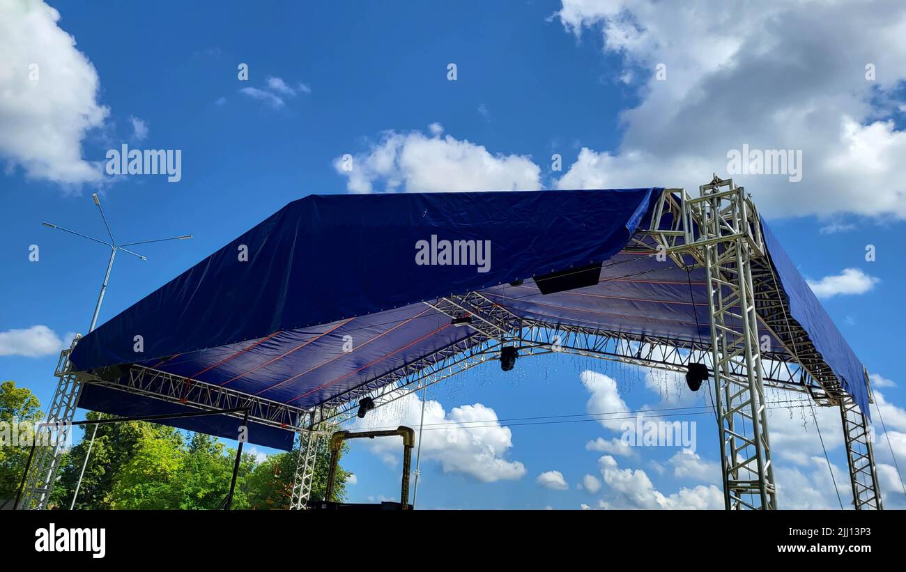 Summer stage in the park for events. Metal construction with a canopy Stock Photo