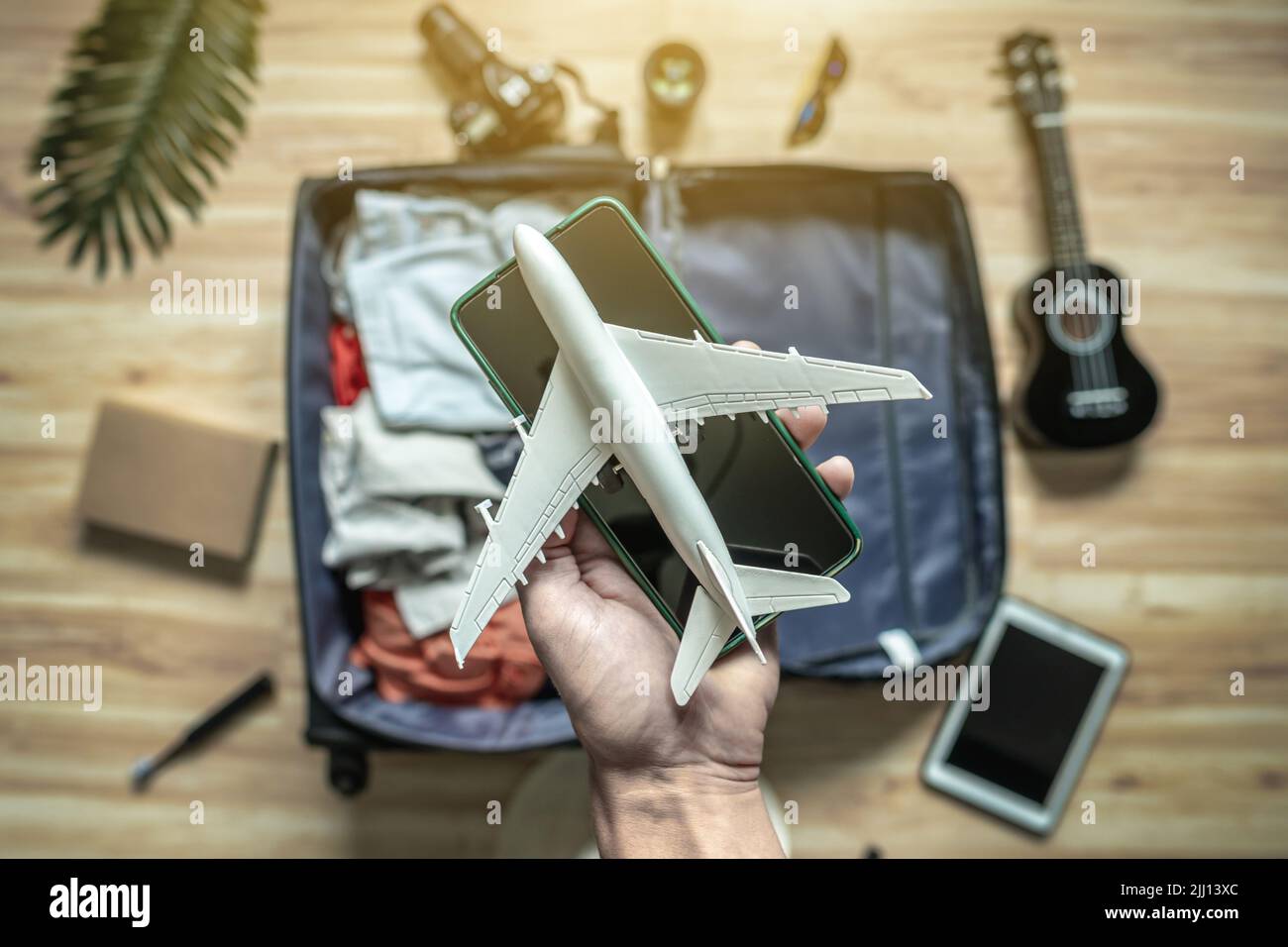 Packing a suitcase for a summer vacation. Preparation of things and documents for a longawaited