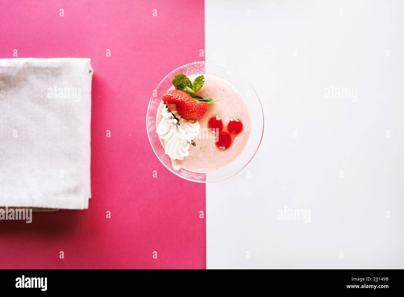 Creamy strawberry dessert on contrast background Stock Photo