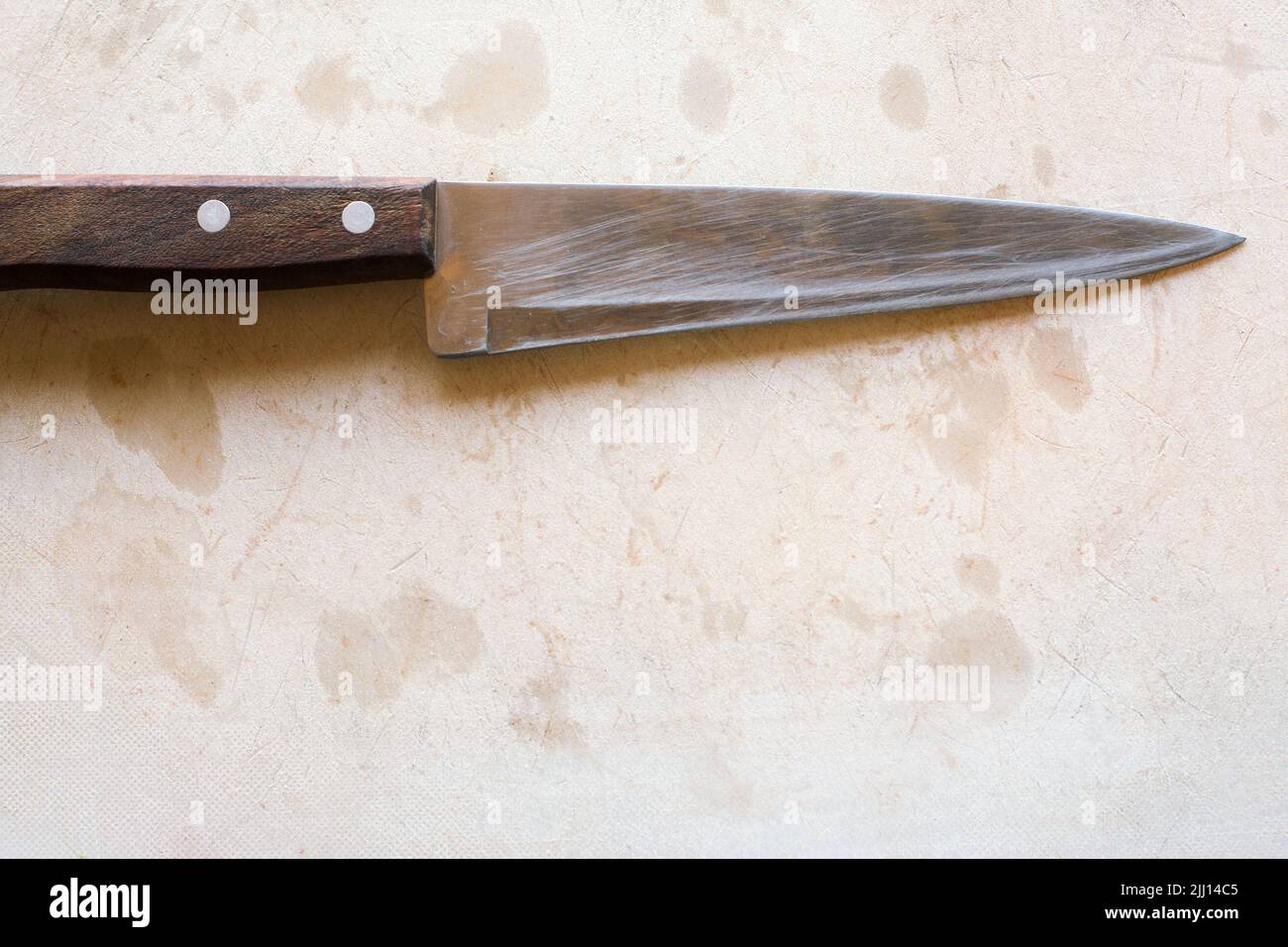 Chef cuts up meat on a cutting board with a sharp knife Stock Photo by  wirestock