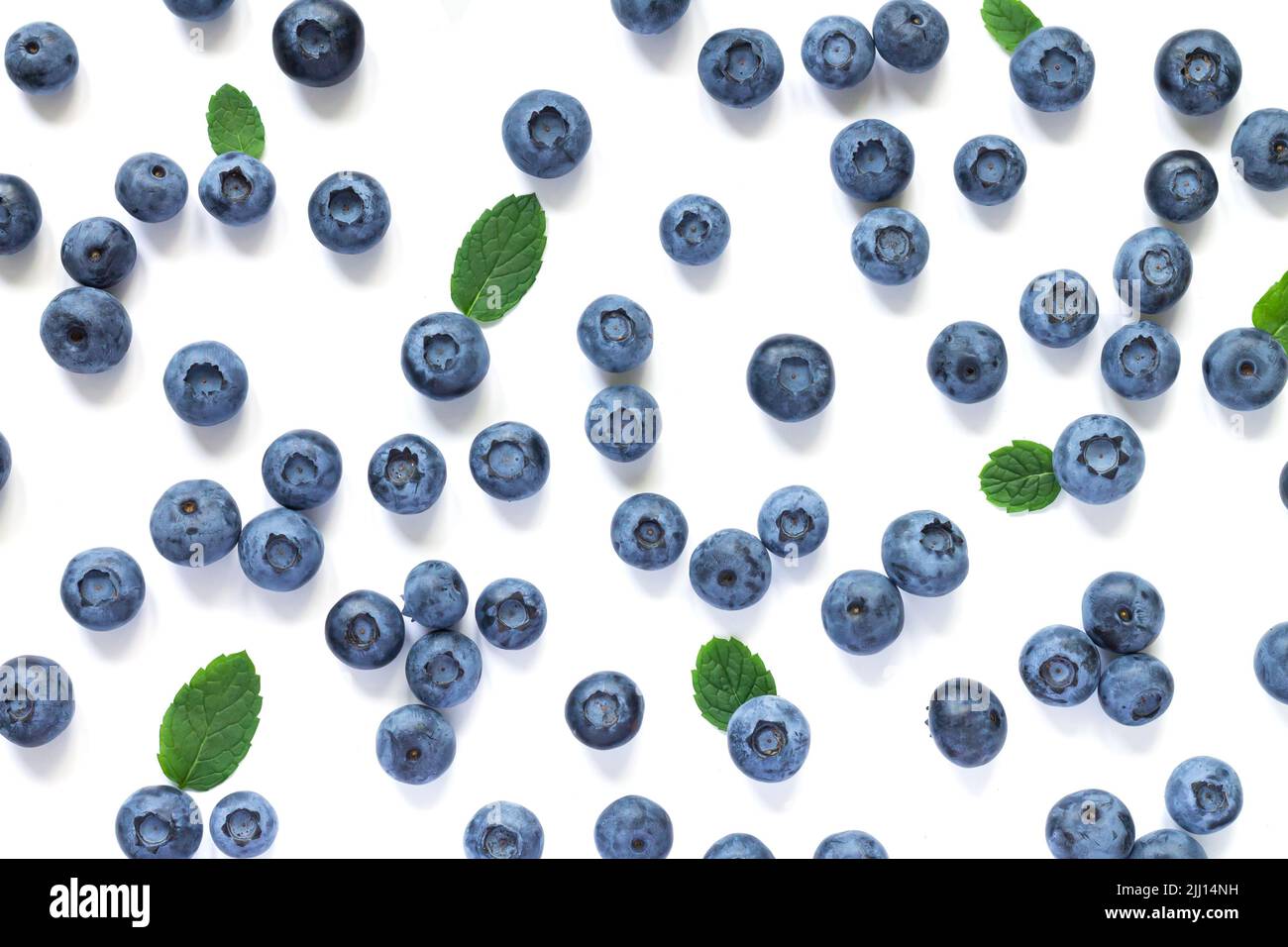 Fresh juicy blueberries with green leaves isolated on white background ...