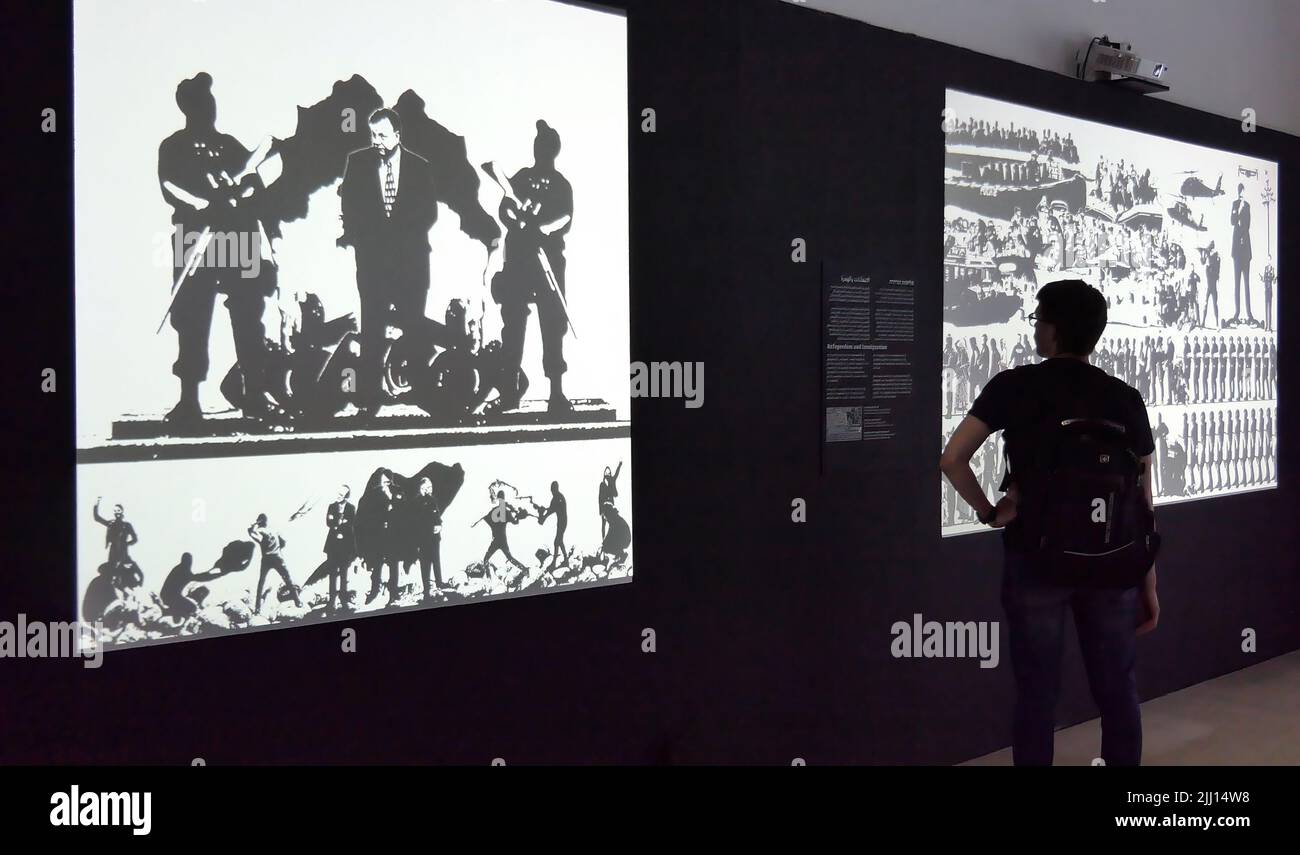 JERUSALEM, ISRAEL - JULY 21: A visitor views a video art installation by Itamar Liebergall entitled 'Collapse' displayed during end of year graduates exhibition of the Visual Communications department of Bezalel Academy of Arts and Design on July 21, 2022 in Jerusalem, Israel. Bezalel is Israel's oldest institution of higher education and is considered the most prestigious art school in the country. Stock Photo