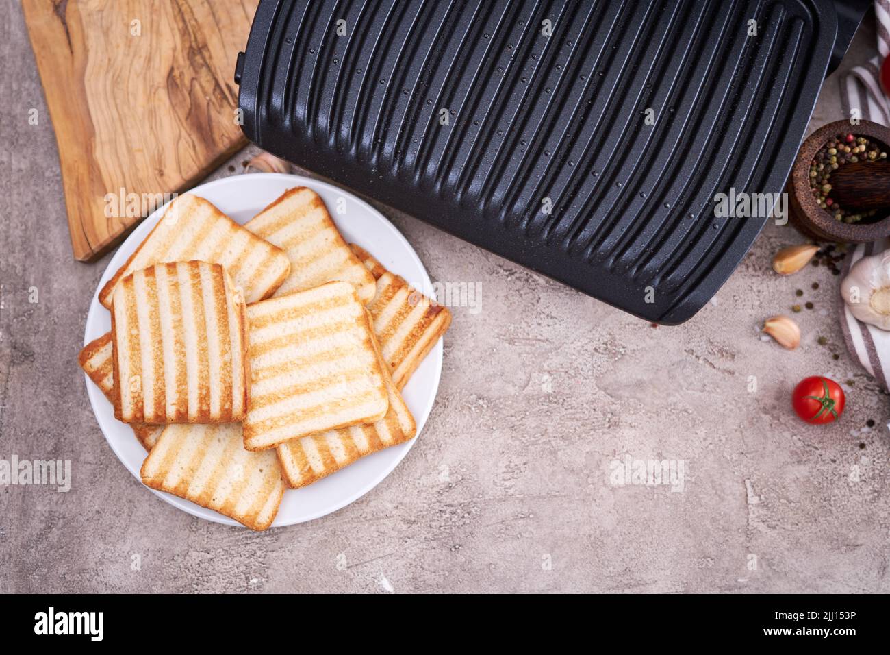 Morning homemade snack Toast bread pan fried on black electric