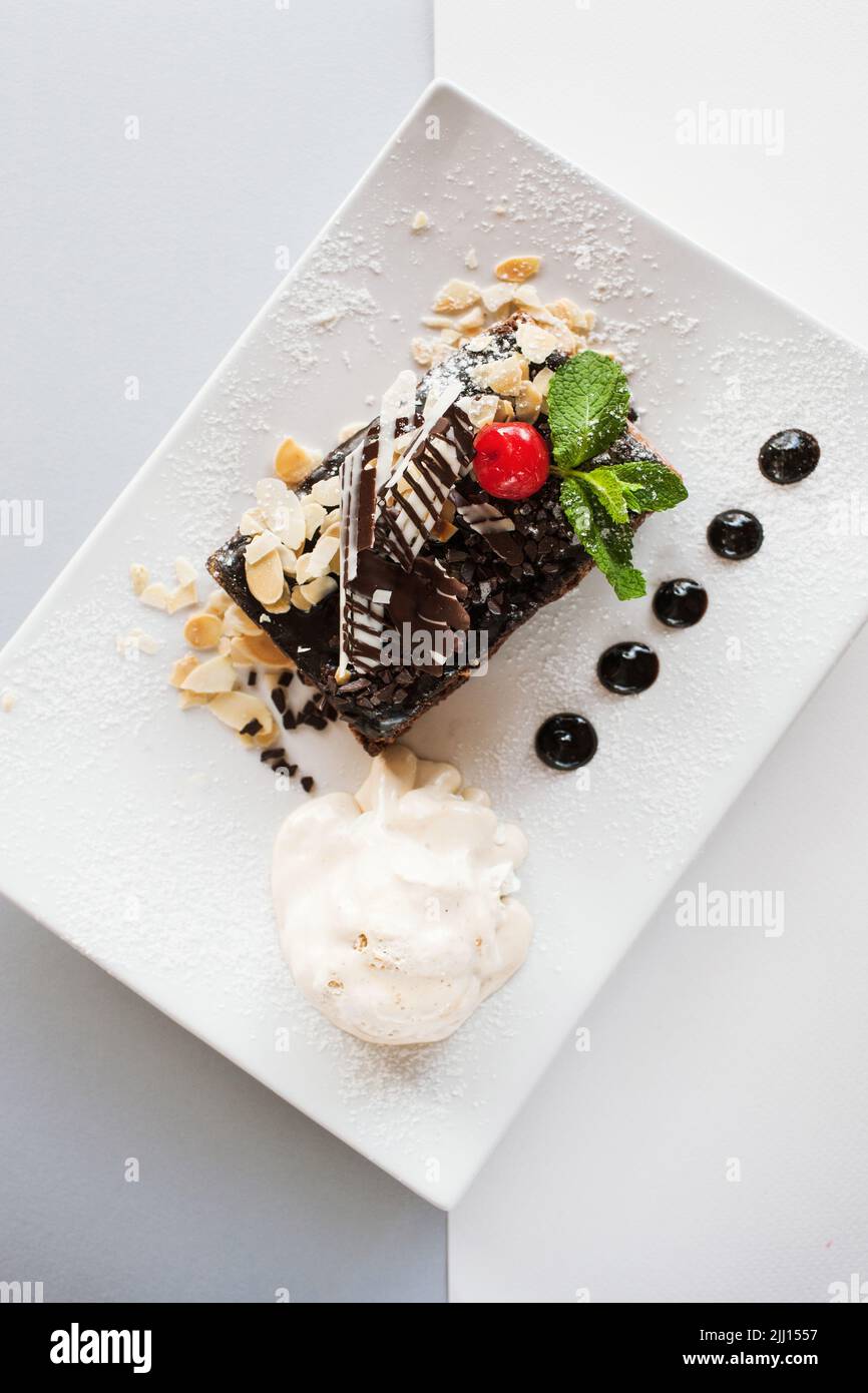 Chocolate pie on white square cut plate Stock Photo