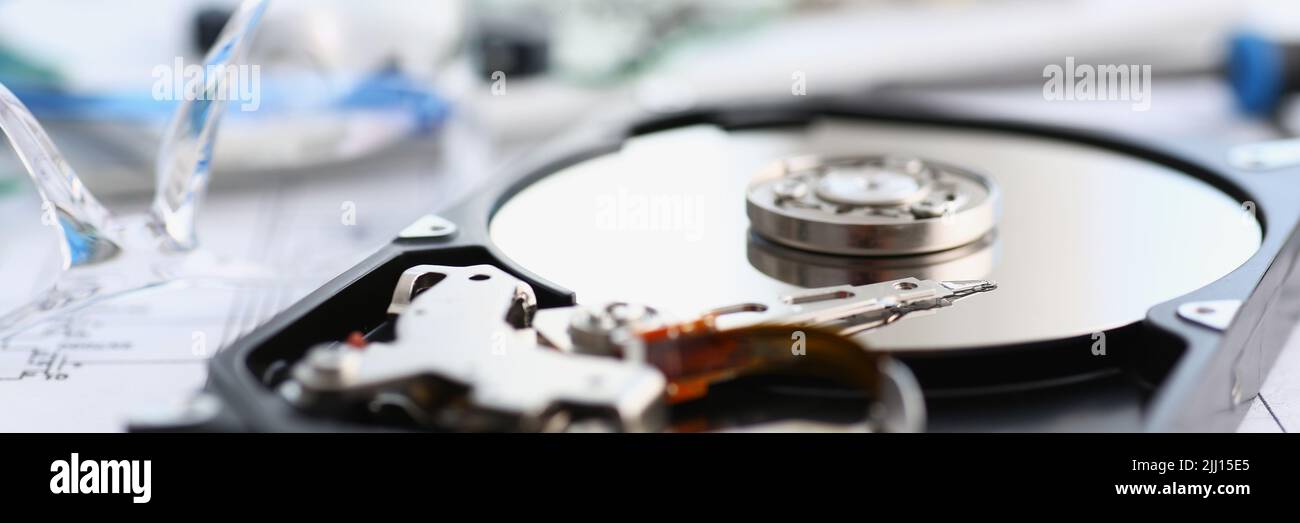 Disassembled hard drive from pc hdd and reader arm, made of plastic and metal Stock Photo