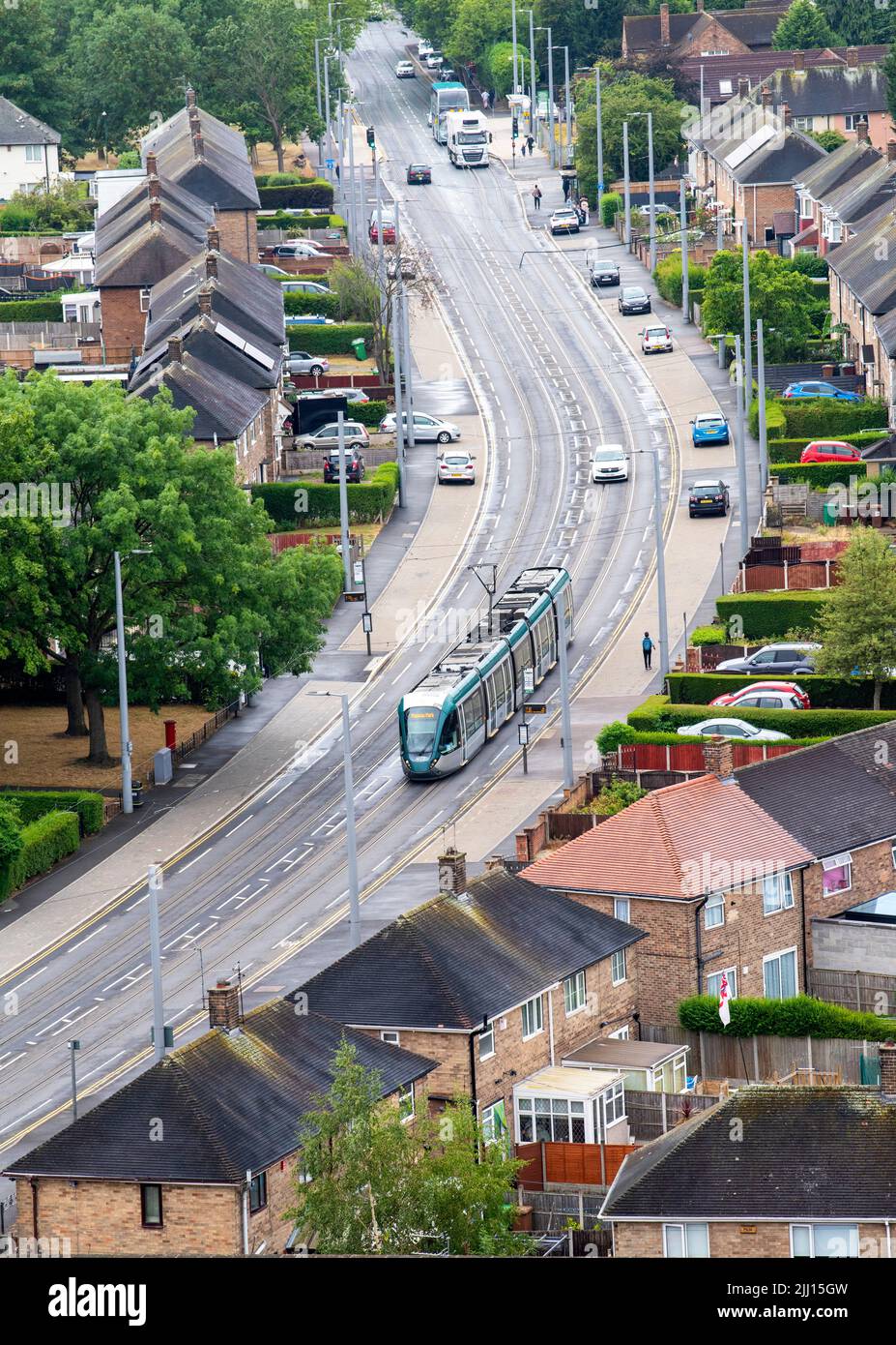 Aerial image of tram on Southchurch Drive in Clifton captured from the roof of Southchurch Court, Nottinghamshire England UK Stock Photo