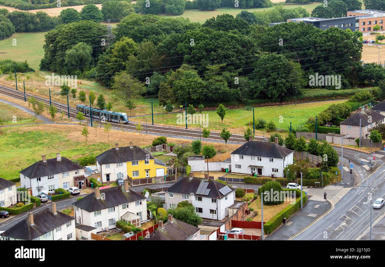 Aerial image of a tram coming in to Clifton, captured from the roof of Southchurch Court, Nottinghamshire England UK Stock Photo