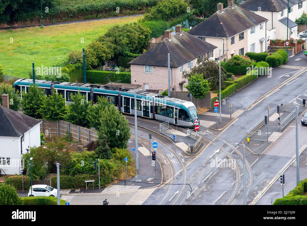 Aerial image of a tram coming in to Clifton, captured from the roof of Southchurch Court, Nottinghamshire England UK Stock Photo
