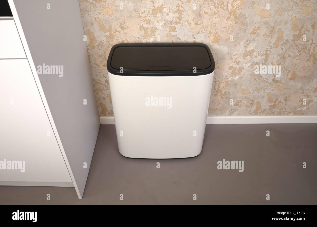 Large white bin in a kitchen, grey floor Stock Photo - Alamy
