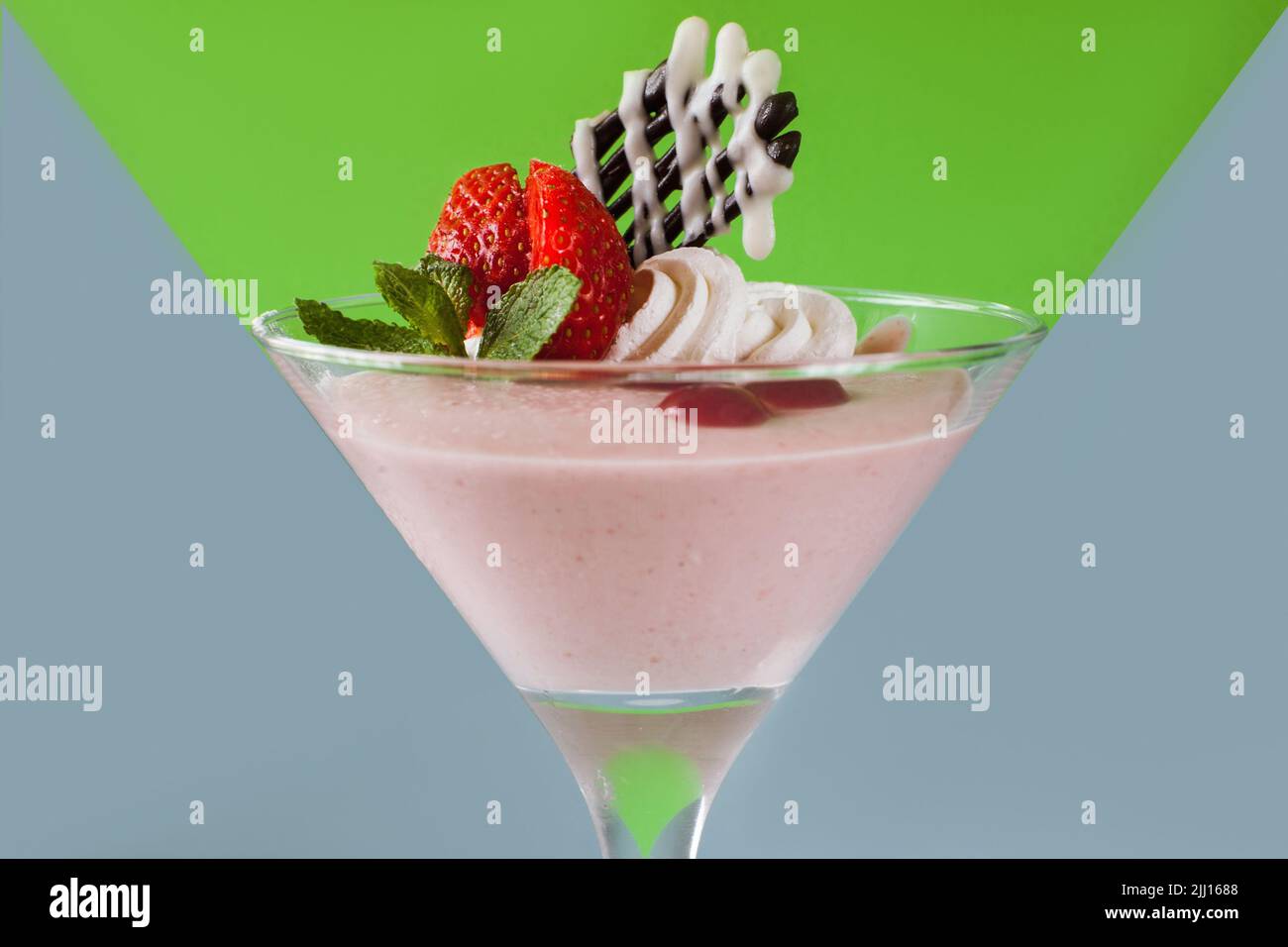Creamy strawberry dessert on contrast background Stock Photo