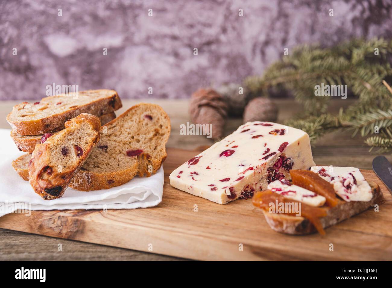 A closeup shot of Wensleydale cheese with cranberries and wine. Stock Photo