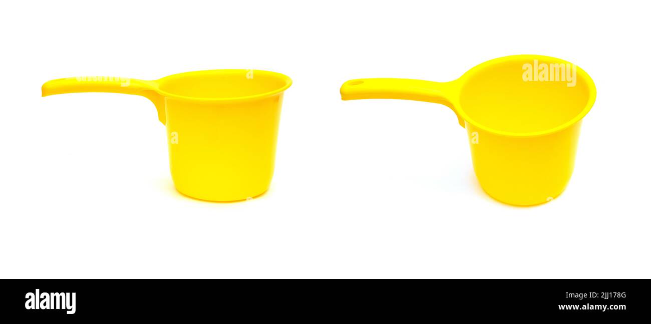 Household plastic yellow dipper for shower, bath Stock Photo
