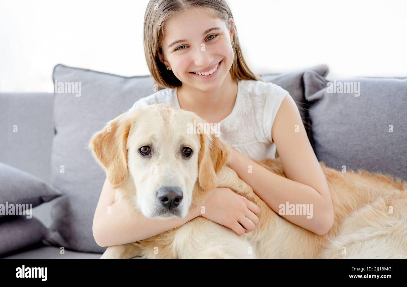 Smiling girl with adorable dog Stock Photo - Alamy