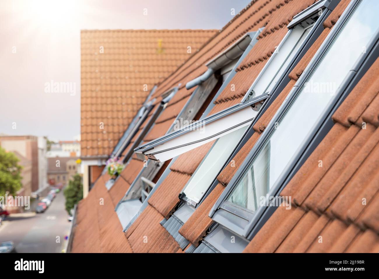 Open ventilation waterproof rooftop window exterior against sunny sky