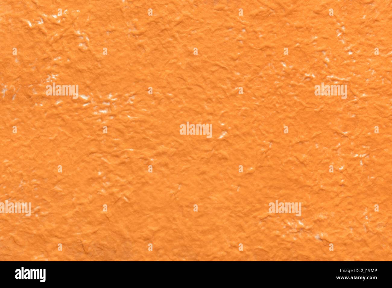 Orange crumpled paper texture background, abstract backdrop Stock Photo