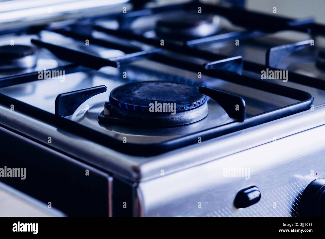 Kitchen gas hob, stove cook with blue flames burning Stock Photo Alamy