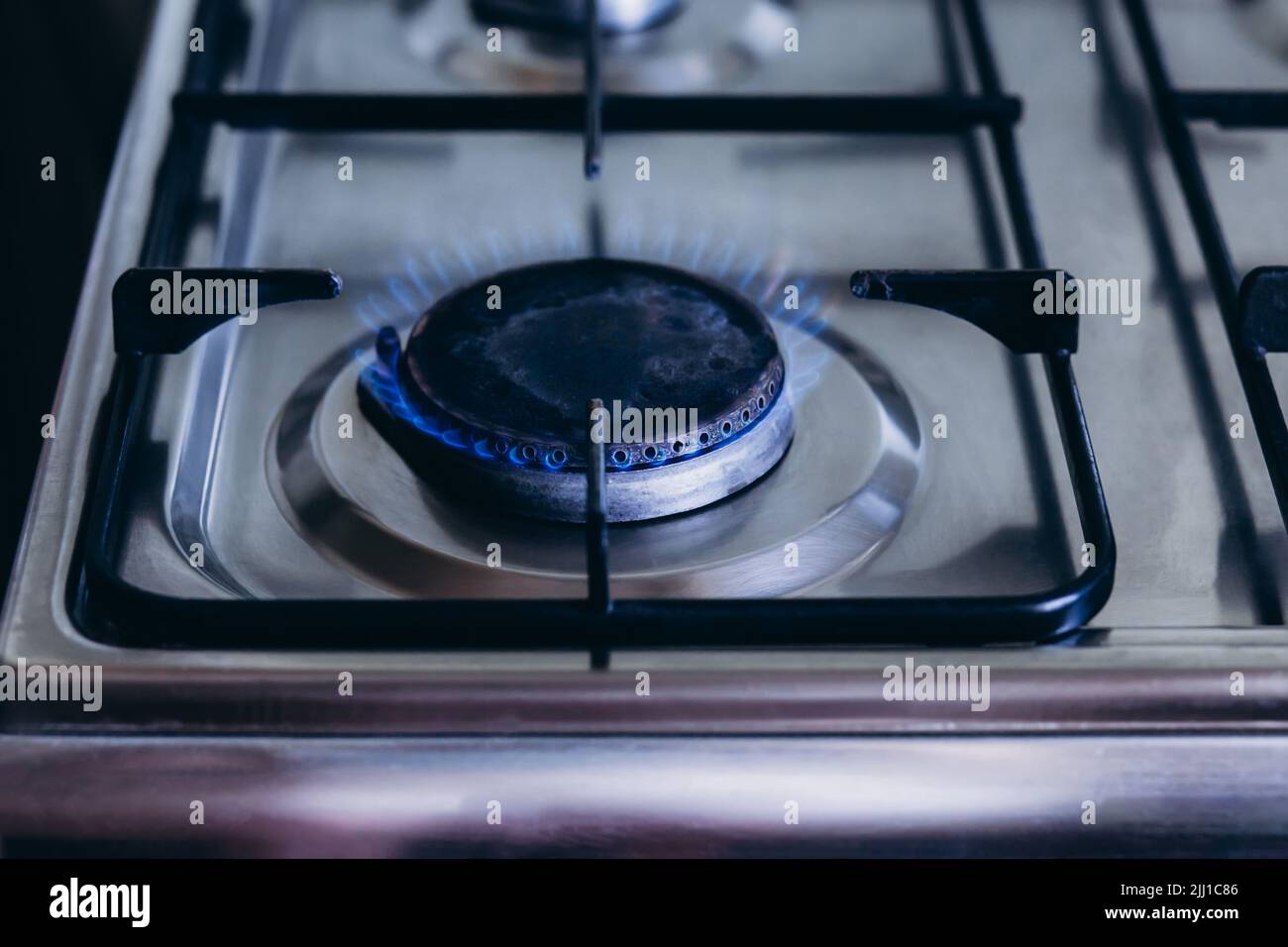 Kitchen gas hob, stove cook with blue flames burning Stock Photo Alamy