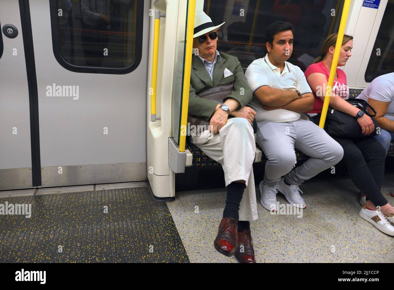 London, England, UK. People sitting on a tube train Stock Photo Alamy
