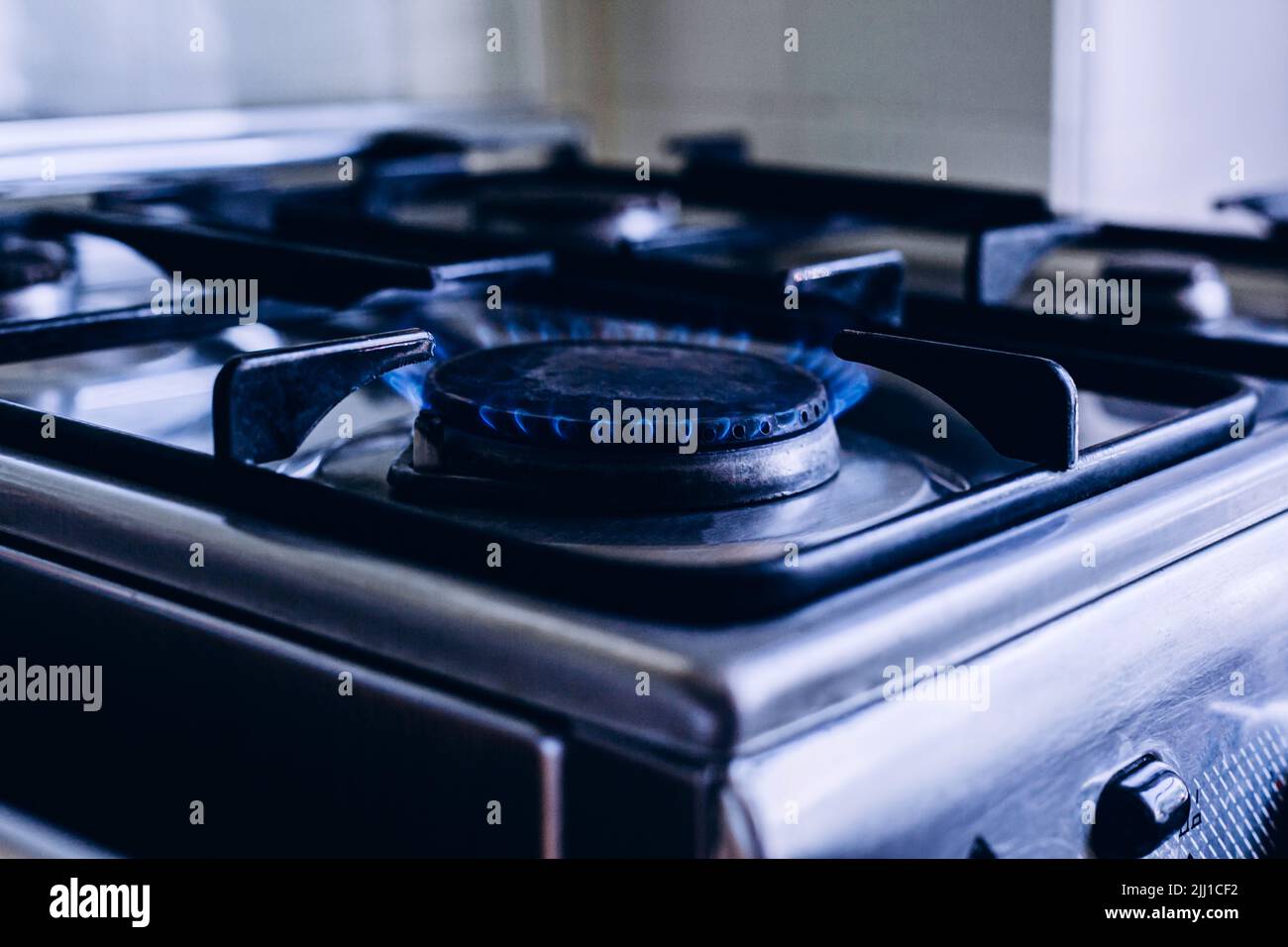 Kitchen gas hob, stove cook with blue flames burning Stock Photo Alamy