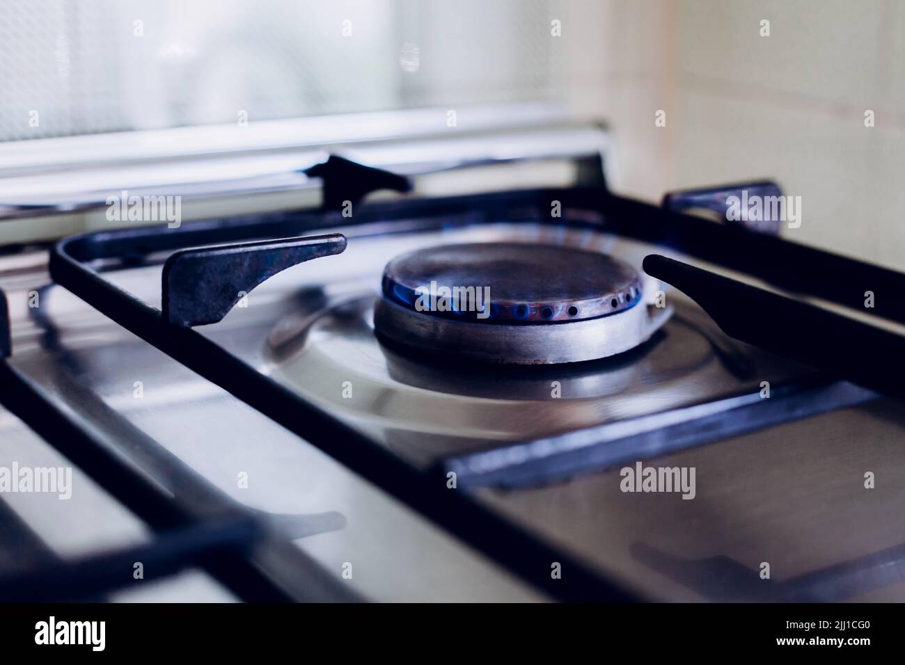 Kitchen gas hob, stove cook with blue flames burning Stock Photo Alamy