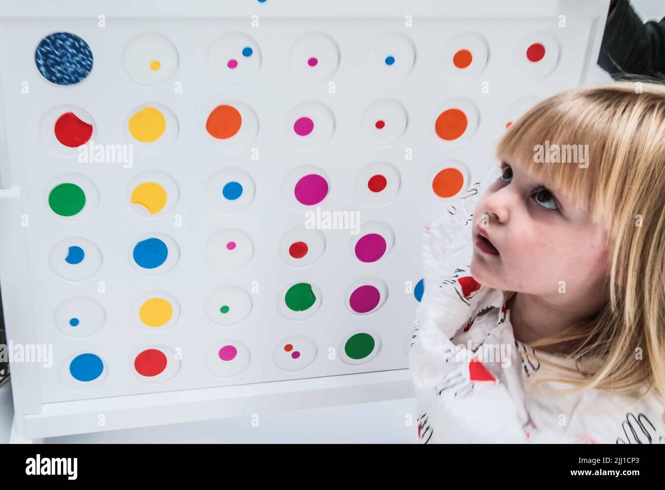London UK 22 July 2022 The obliteration room at Tate Modern will be the first to root the installation within a London context, with objects and white  furniture donated by local community groups placed inside the apartment ready to be adorned with multicolored stickers.  Paul Quezada-Neiman/Alamy Live News Stock Photo