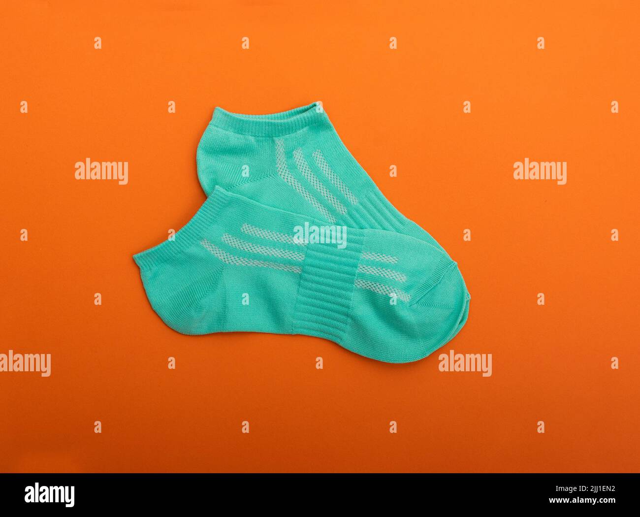 One green sock on pure white background Stock Photo