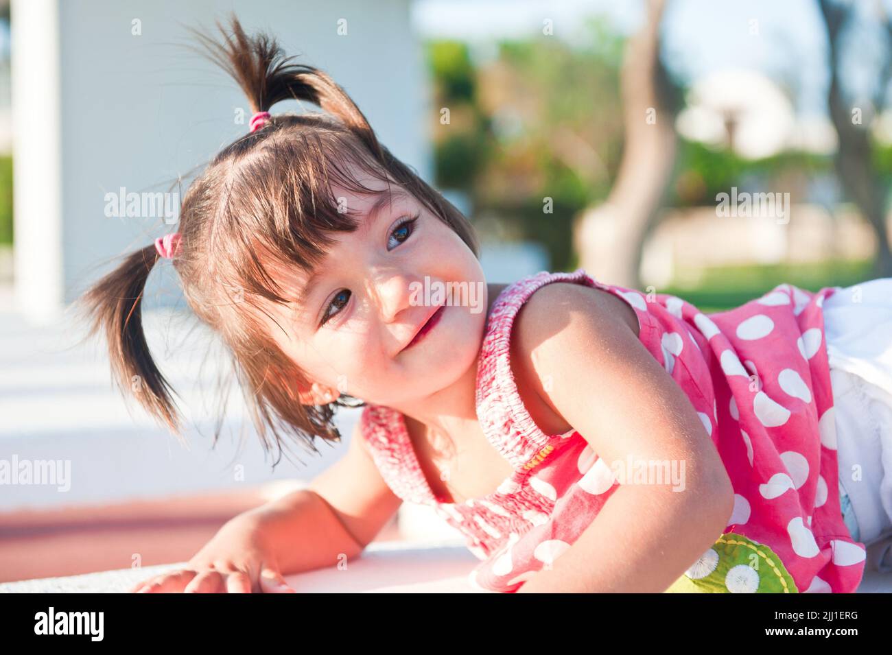 The cheerful, joyful girl with tails Stock Photo