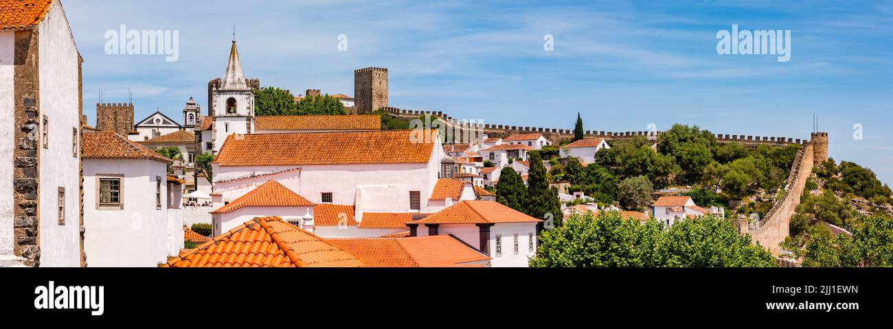 Panorama of the old town of Obidos with castle, church and walkable city wall, Portugal Stock Photo
