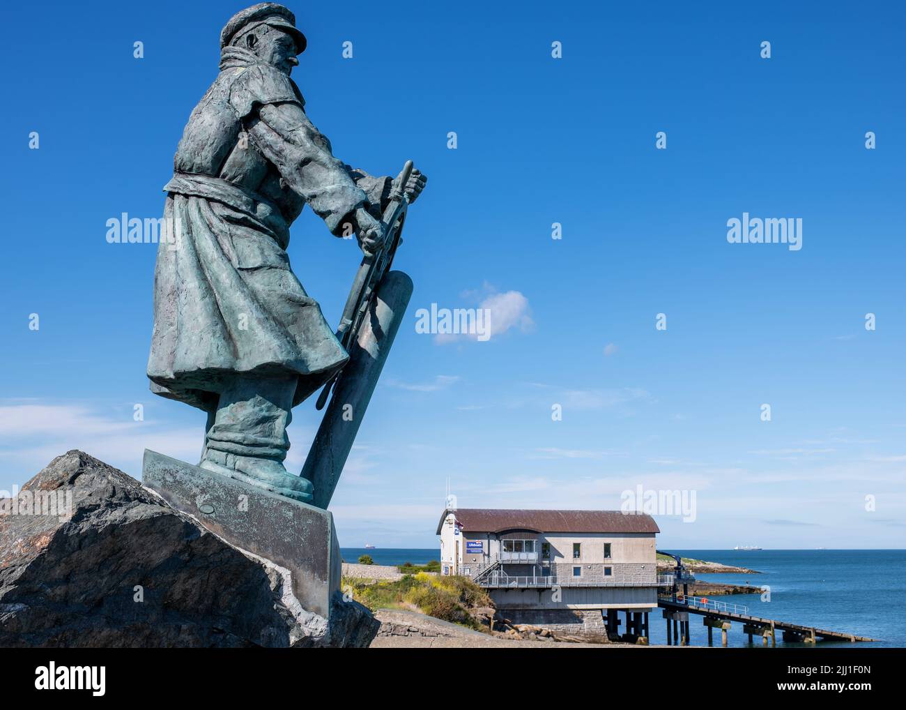 The striking memorial, by Sam Holland 2004, to the brave lifeboat coxswain Dic Evans BEM , Moelfre, Anglesey,  Wales Stock Photo