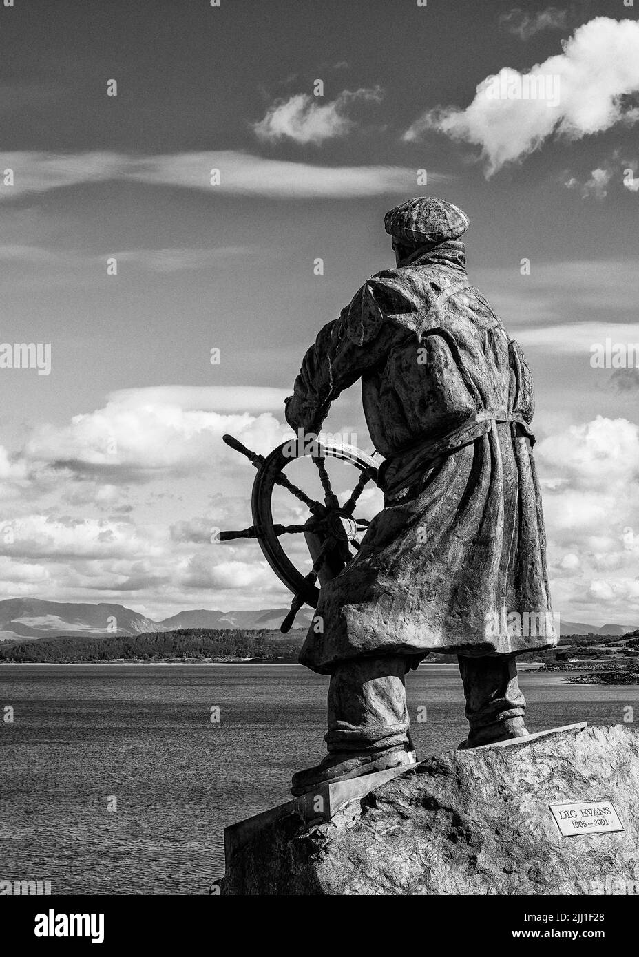 Dic Evans, lifeboat coxswain, facing the Irish Sea with Red Wharf Bay and Snowdonia in the background, Moelfre, Anglesey,  Wales Stock Photo
