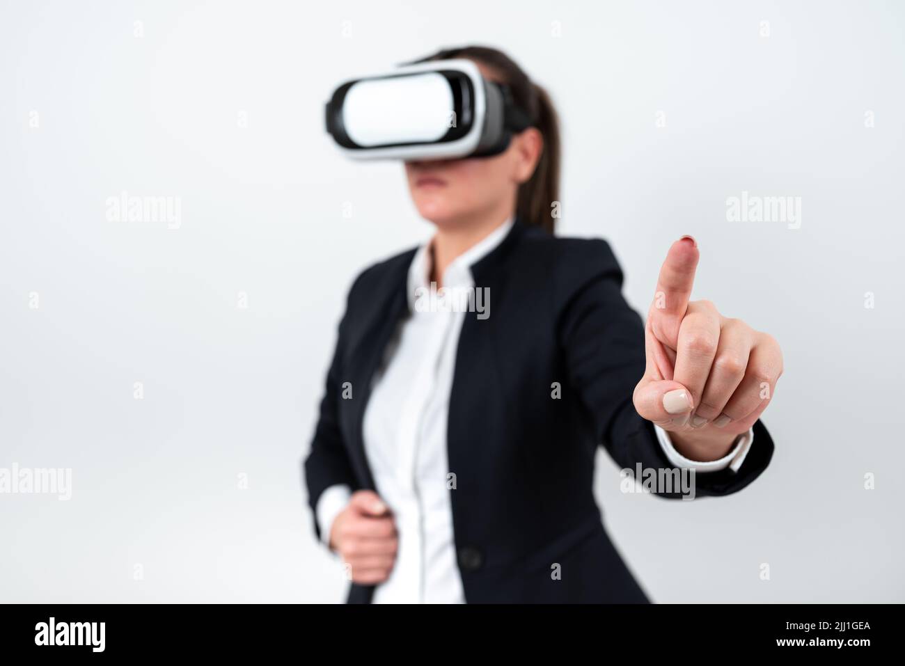 Woman Wearing Vr Glasses And Pointing On Important Messages With One