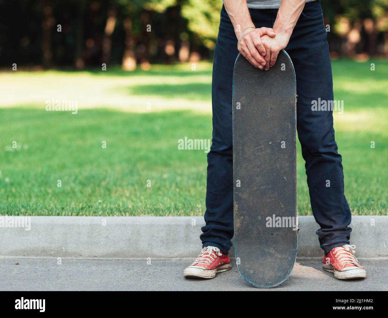 Active adult. Summer sport background at park Stock Photo