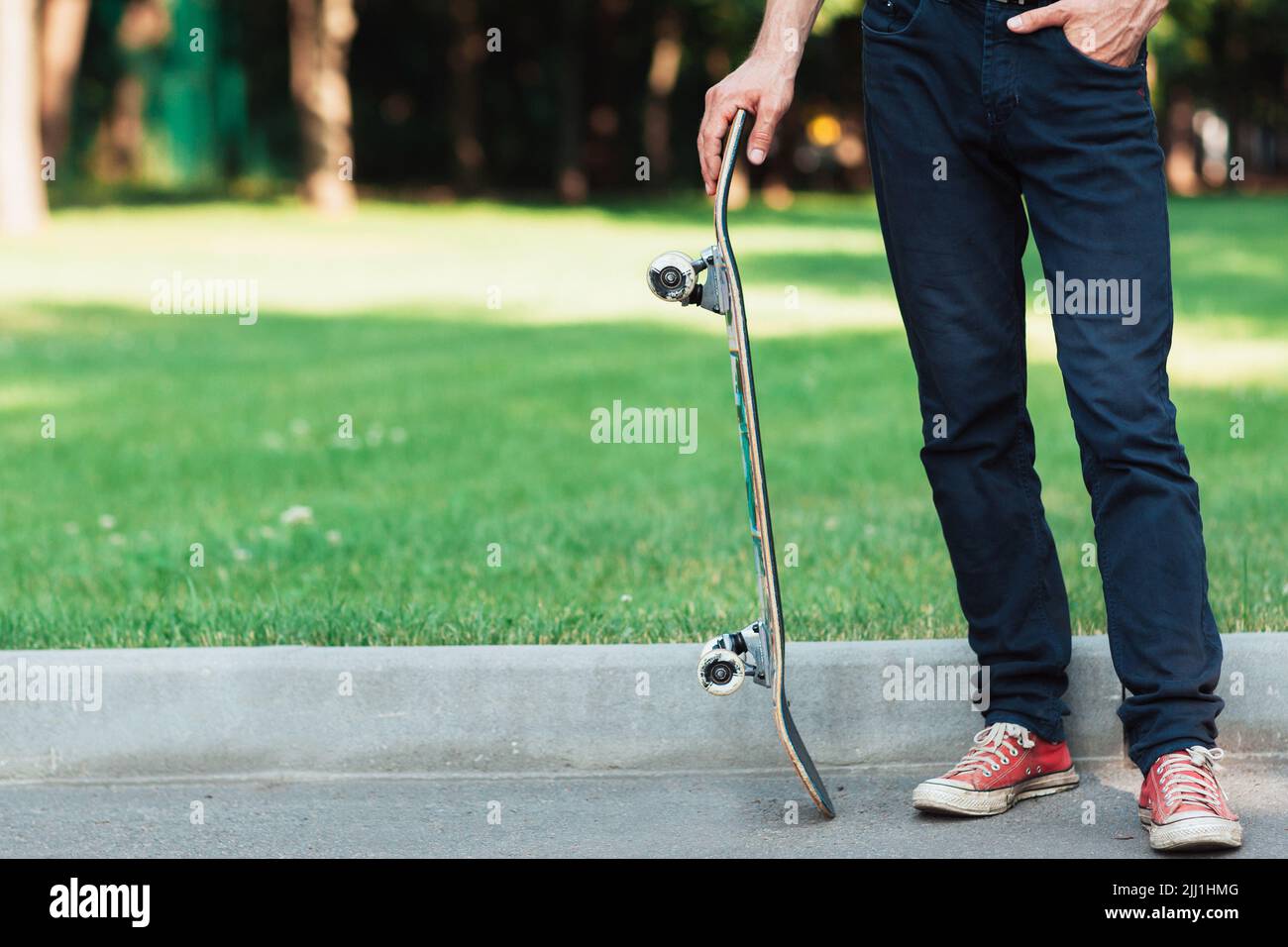 Active adult. Summer sport background at park Stock Photo